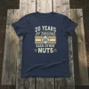 Navy blue t-shirt with white text "20 YEARS OF DRIVING EACH OTHER NUTS" and a graphic of gears and wedding
