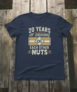 Navy blue t-shirt with white text "20 YEARS OF DRIVING EACH OTHER NUTS" and a graphic of gears and wedding