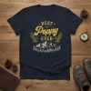 Best Poppy Ever t-shirt with vintage mountain, eagle, and bird graphics. Text reads "BEST Poppy EVER" in distressed gold font