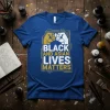Black and Asian Lives Matters text with gold and white unity fists graphic on a blue t-shirt