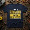 I AM A CHRISTIAN UNDER CONSTRUCTION GOD'S NOT DONE WITH ME YET! text on a navy t-shirt with yellow construction