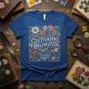 Cultivando Bilingues t-shirt with floral border and open book graphic, celebrating language learning and bilingualism