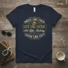 T-shirt design with text "DRESS LIKE COCO LIVE LIKE JACKIE Act Like Audrey LAUGH LIKE LUCY" in elegant gold font