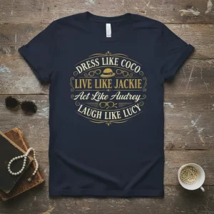 T-shirt design with text "DRESS LIKE COCO LIVE LIKE JACKIE Act Like Audrey LAUGH LIKE LUCY" in elegant gold font