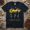 Faith Hope Love Ewings Sarcoma Awareness t-shirt with sunflower, butterfly, and heart graphic. Yellow ribbon detail included