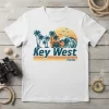 Key West Florida t-shirt design with vintage sunset, palm trees, and ocean wave graphic