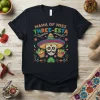 Mama of Miss Three-esta t-shirt design featuring a sugar skull wearing a sombrero and colorful festive decorations