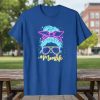 Neon #Momlife text with a messy bun and sunglasses graphic on a blue t-shirt